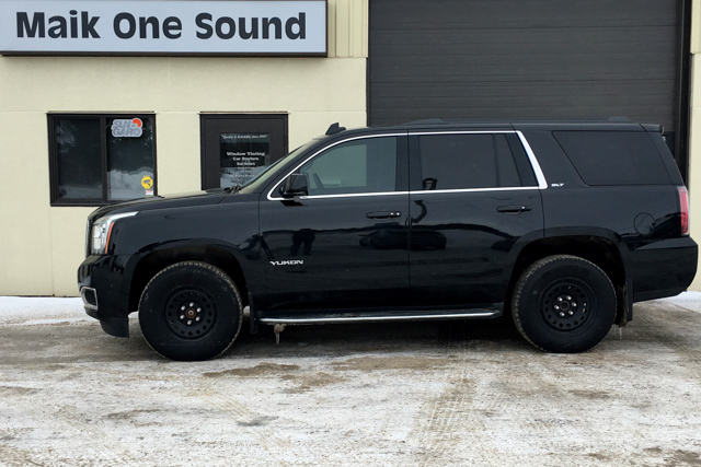 2017 GMC Yukon with professional window tint in North Bay